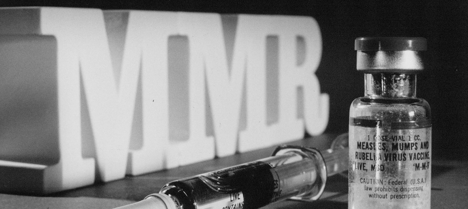 Vial of M-M-R vaccine with syringe