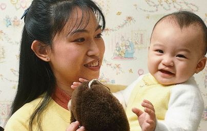 Woman playing with baby
