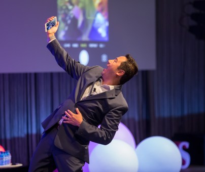 Man takes selfie on stage