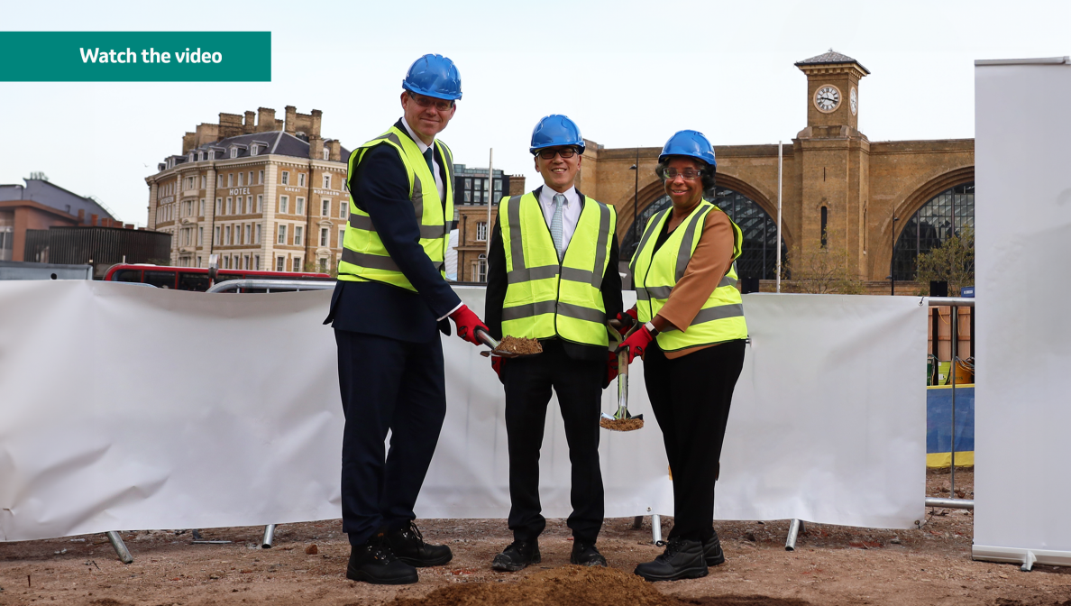 3 people in hard hats breaking ground