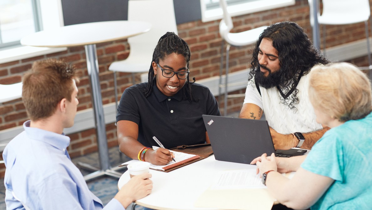 Inspiring diverse colleagues collaborate over innovative strategy through diversity and inclusion