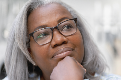 Woman with glases ponders