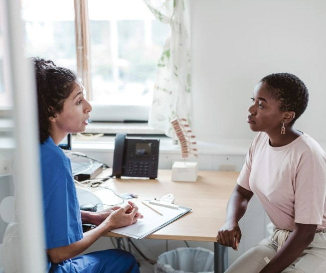 Patient listens intently to doctor