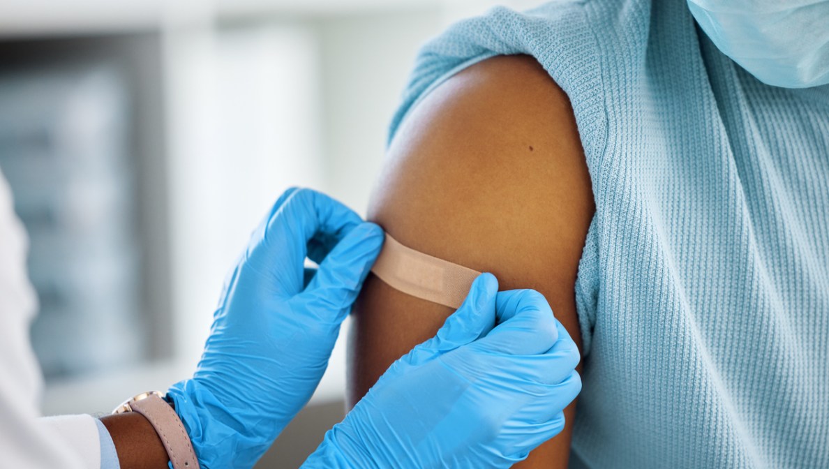 bandaid being applied to arm