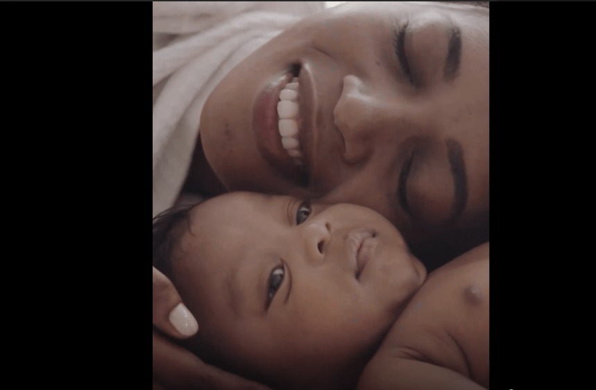 mother and baby smiling at each other