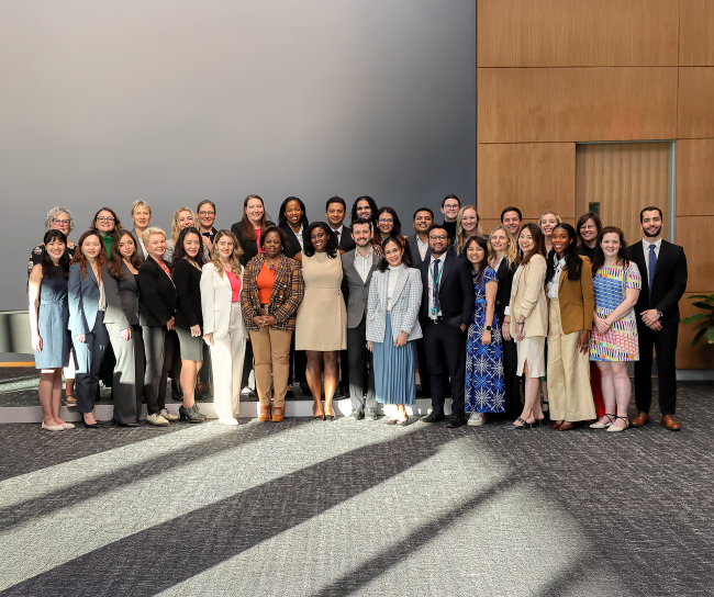 large group of colleagues posing for a photo