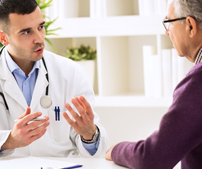 Doctor speaking with patient