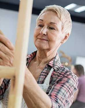 Elderly woman in shirt and apron