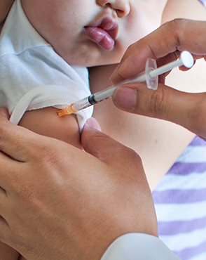 Baby getting vaccination shot