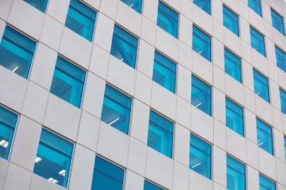 Outside of corporate building with blue windows
