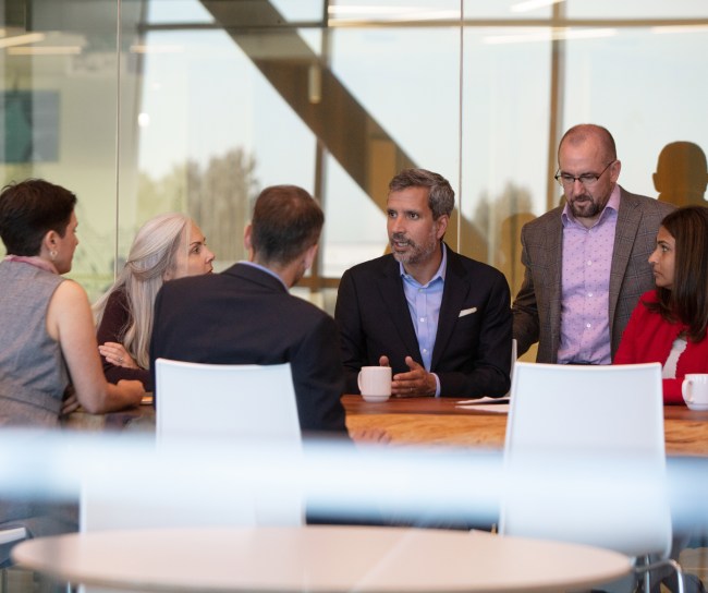 team of executives at a conference table