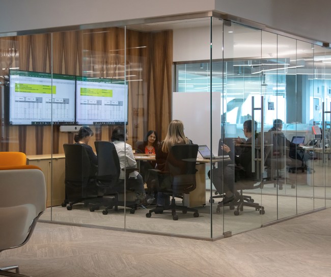 Team of working together in a glass office