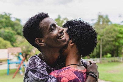 Two African men hugging