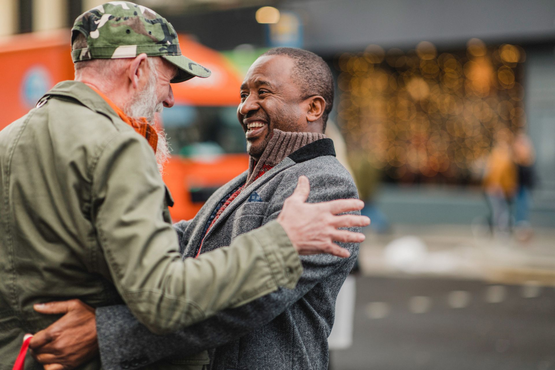 Two older men embrace