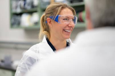 Scientist smiling wearing goggles