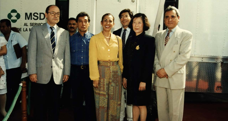 Group of people standing by MSD logo outdoors