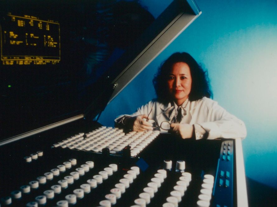 Female scientist posing with medical equipment