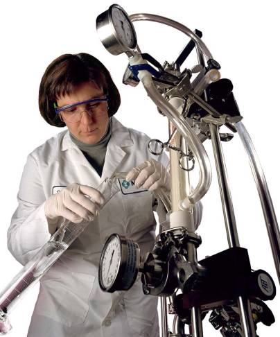 Scientist works with large medical equipment