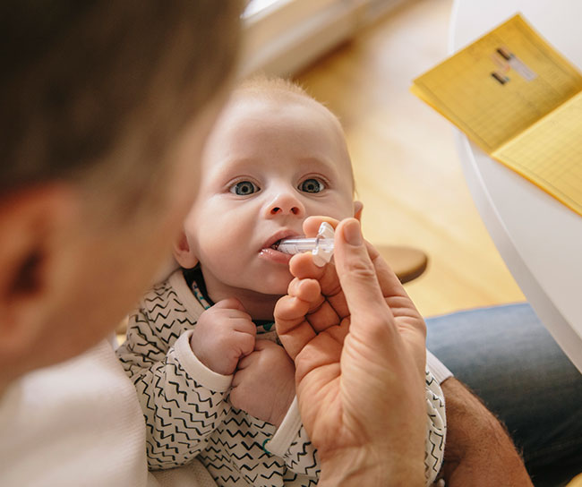ITL baby receiving vaccine