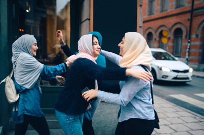 Women greeting each other on the street