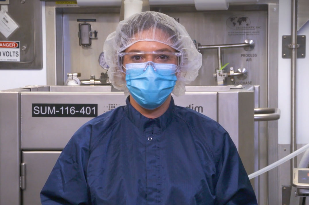 Woman in the lab with a mask