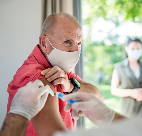 older man getting a shot