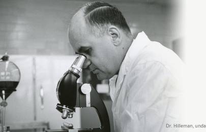 Maurice Hilleman looking into a microscope
