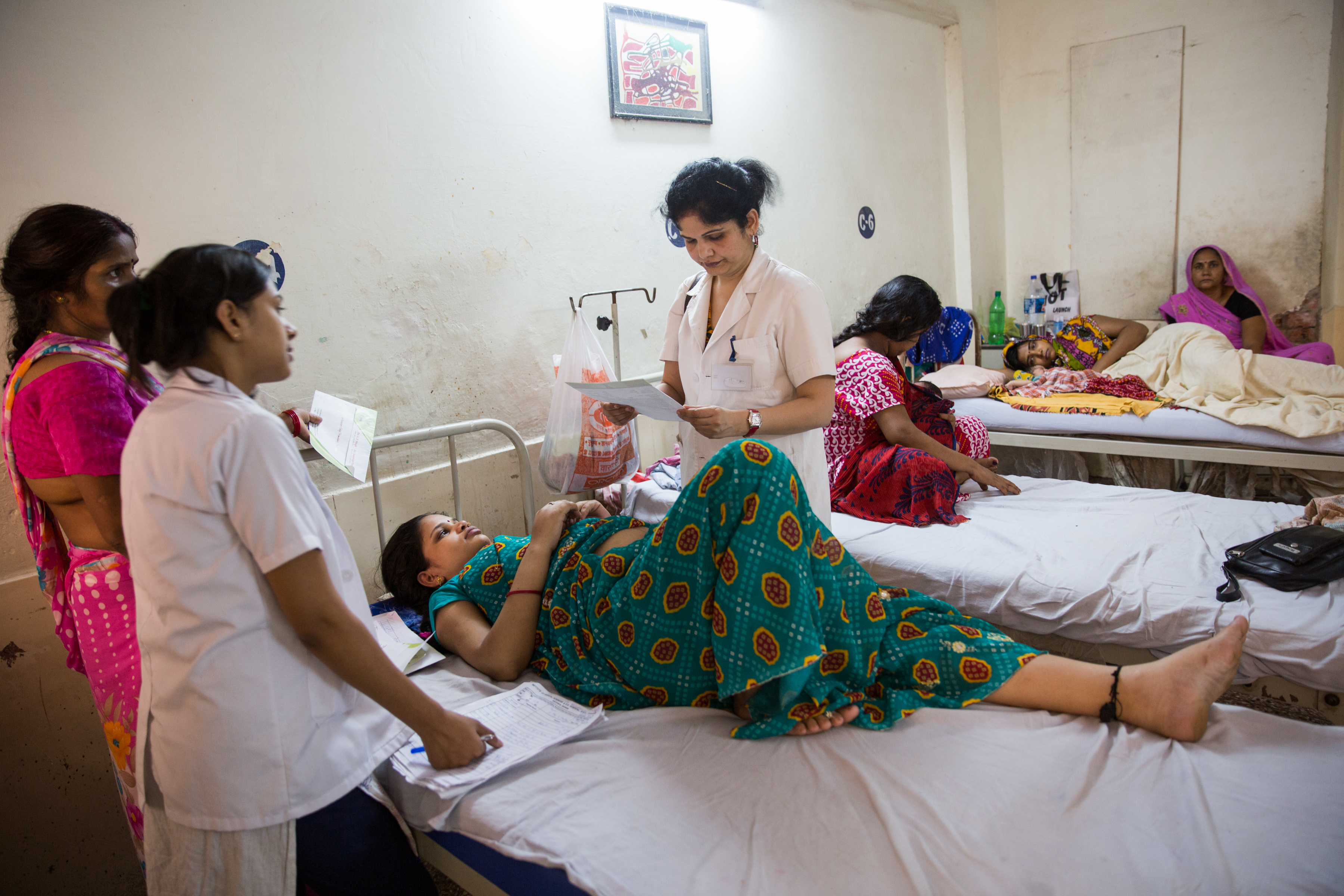 Female doctor on her rounds at hospital in India