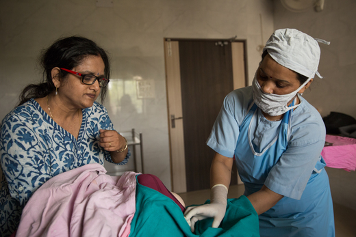 female doctor working with nurse