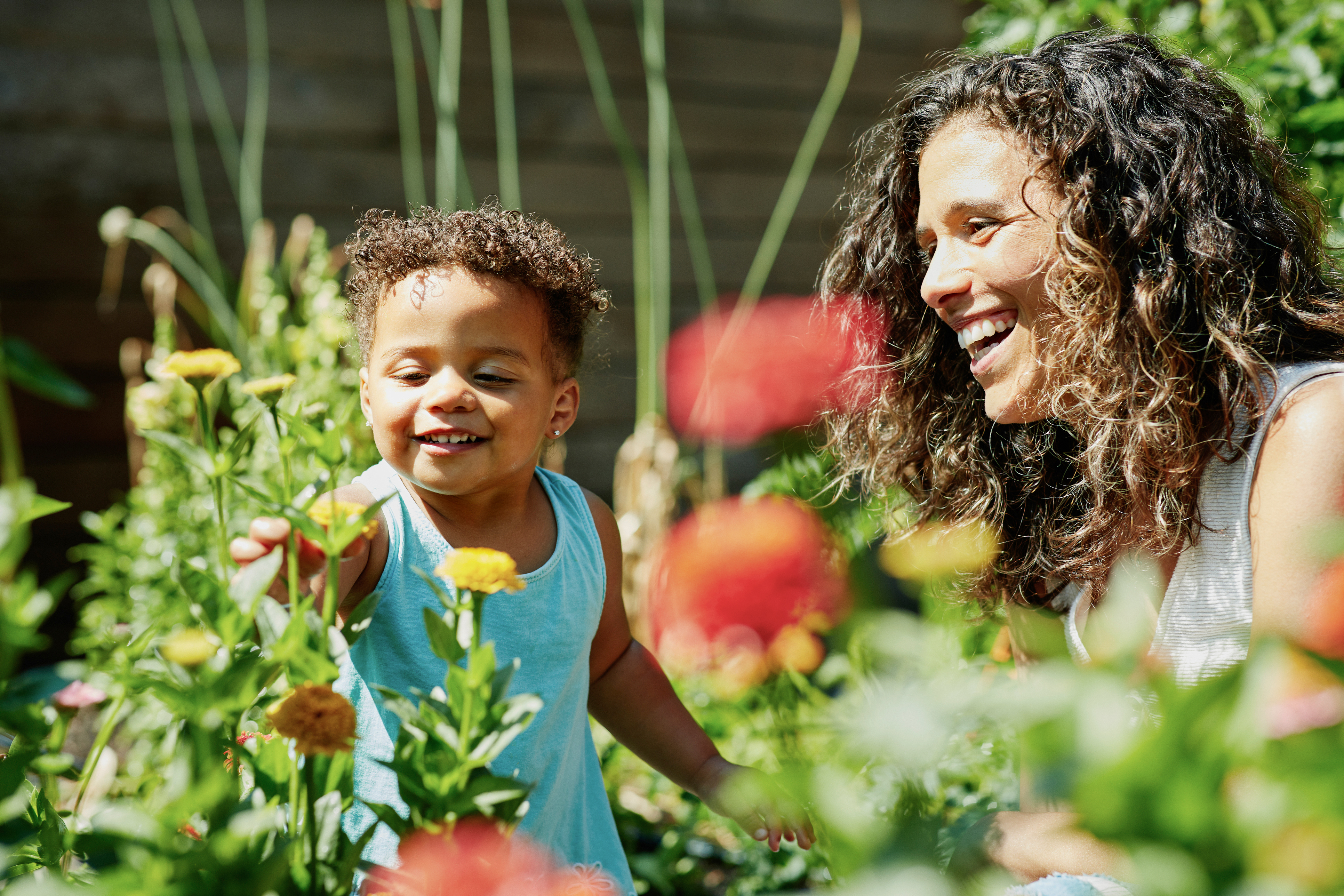 a mother and child in the garden