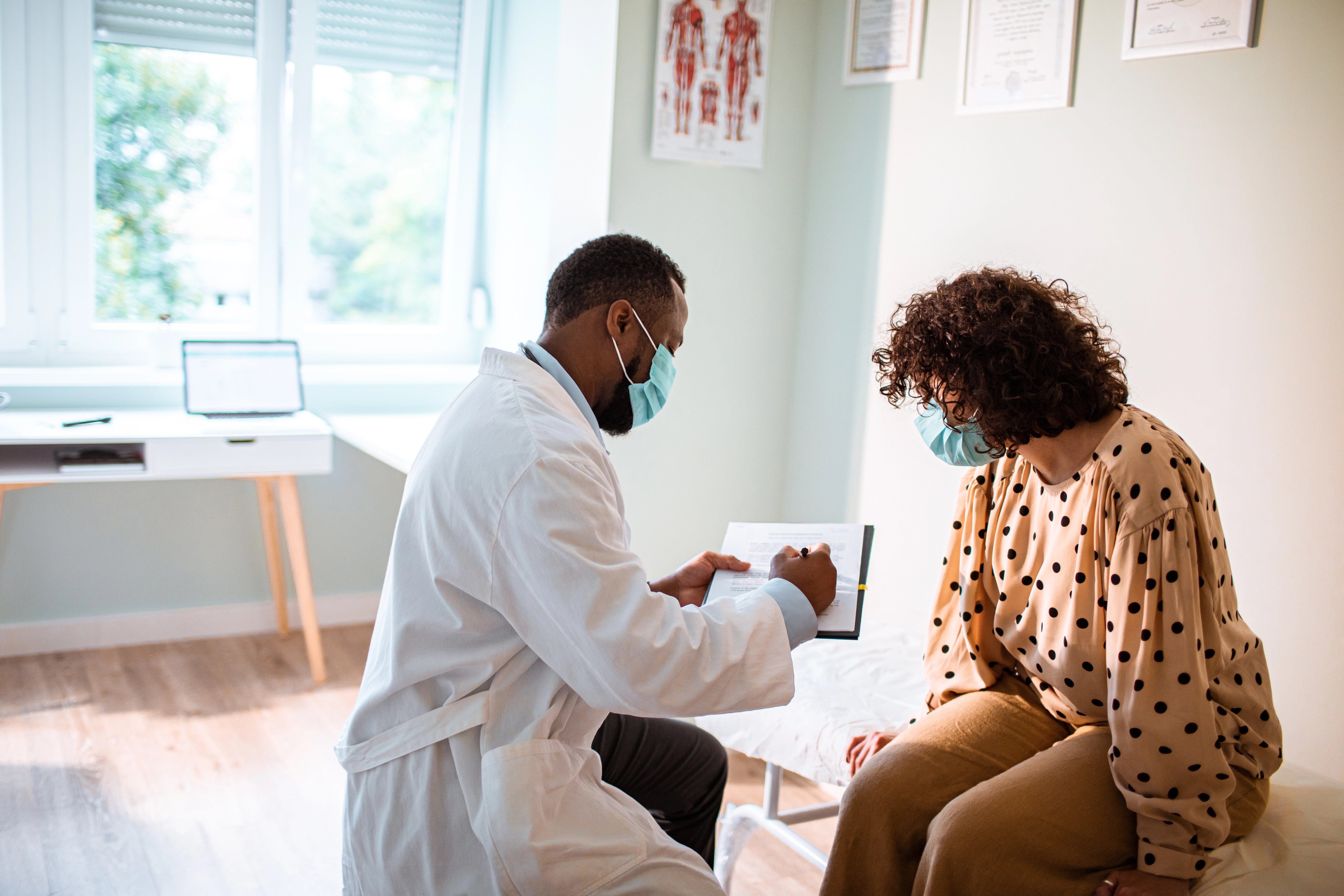 woman at the doctor wearing a mask