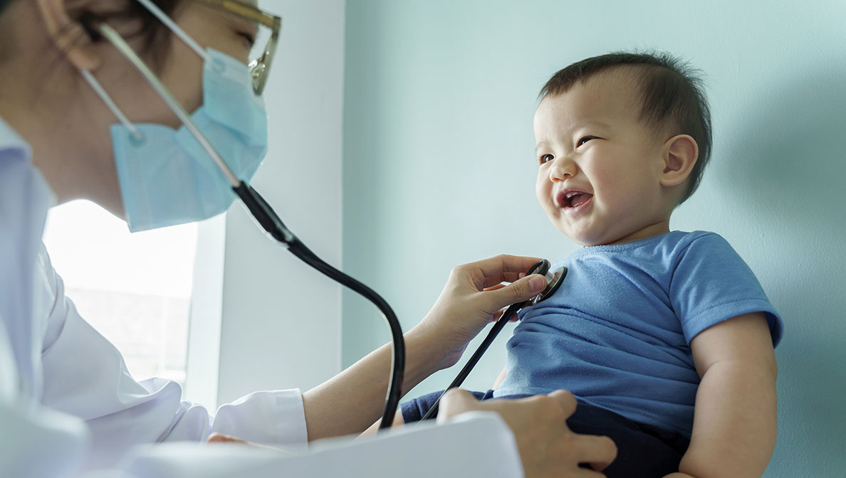 baby getting checked by the doctor