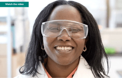MSD scientist Denarra Simmons wearing goggles and lab coat in a lab