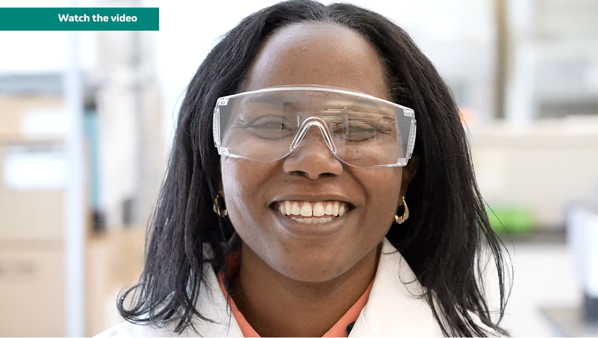 MSD scientist Denarra Simmons wearing goggles and lab coat in a lab