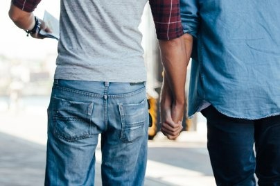 two individual holding hands