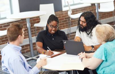 Inspiring diverse colleagues collaborate over innovative strategy through diversity and inclusion