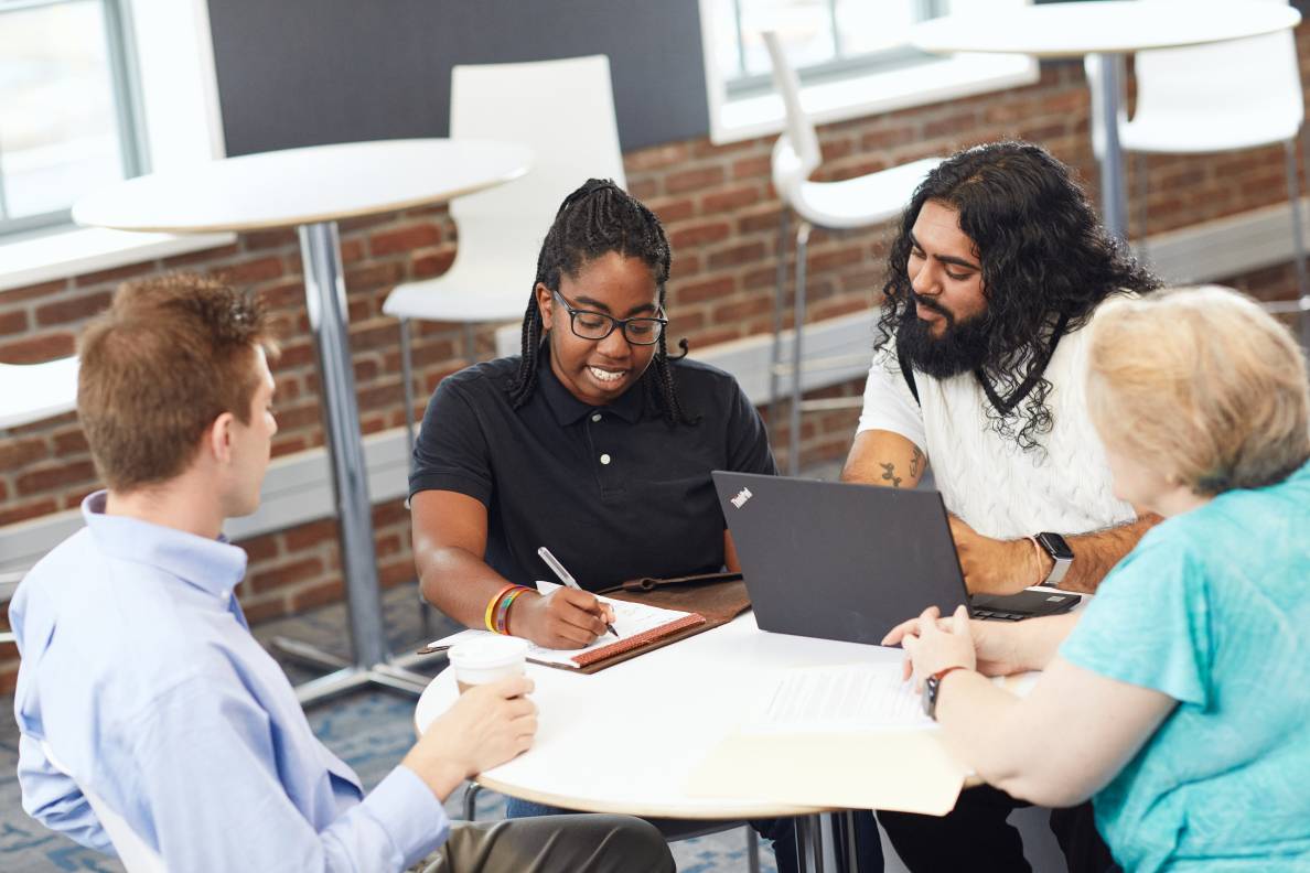 Inspiring diverse colleagues collaborate over innovative strategy through diversity and inclusion