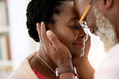 man holding wife's face in his hands