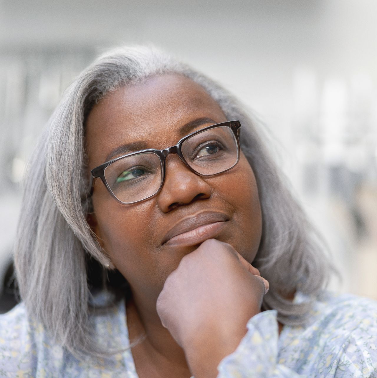 Woman with glases ponders