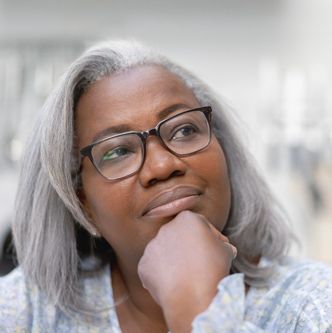Woman with glases ponders