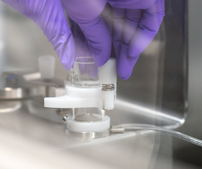 Gloved hands work on labs