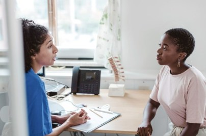 Patient listens intently to doctor