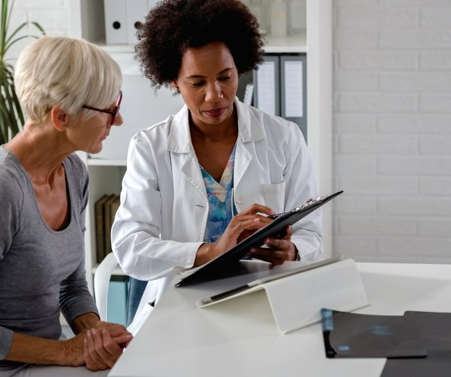 Doctor works with patient