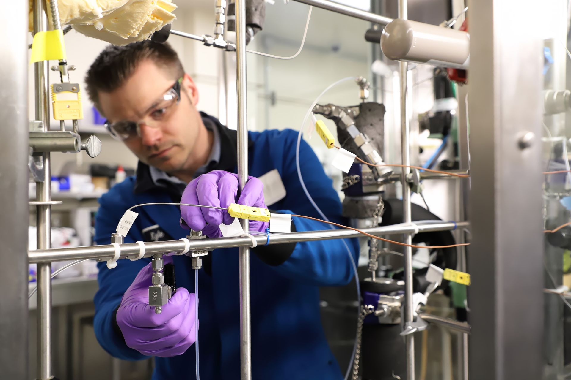 Person working in lab using valve