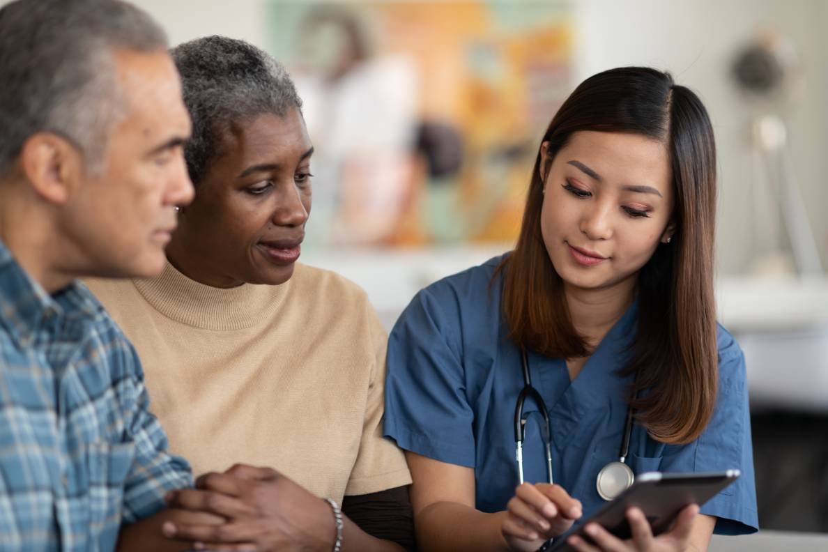 Senior couple reviewing medical information with a health care provider