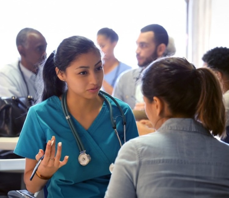 Group of doctors consulting their patients