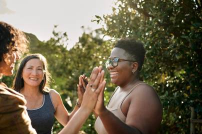 3 women laughing at wellness retreat