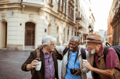 Three people outdoors smiling.