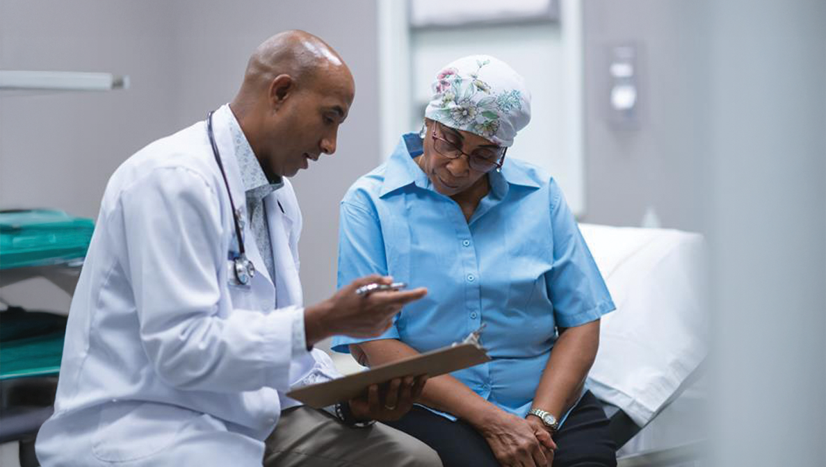 Doctor and patient review paperwork