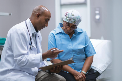 Doctor and patient review paperwork